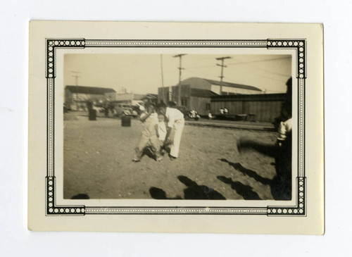 Children and business buildings on Terminal Island