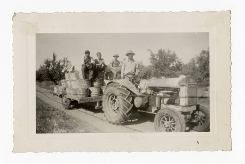 Takahashi brothers on John Deere tractor