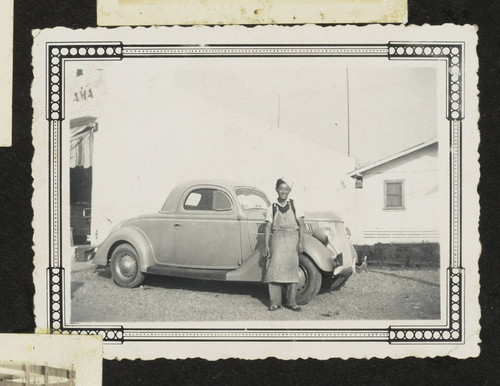 Young man in front of car