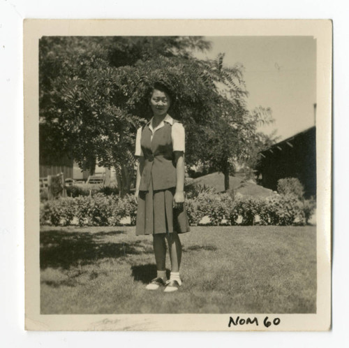 Photograph of a girl in Manzanar garden