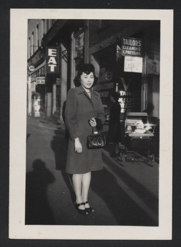 Woman on city sidewalk