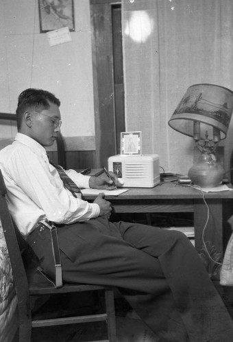 Man seated at desk