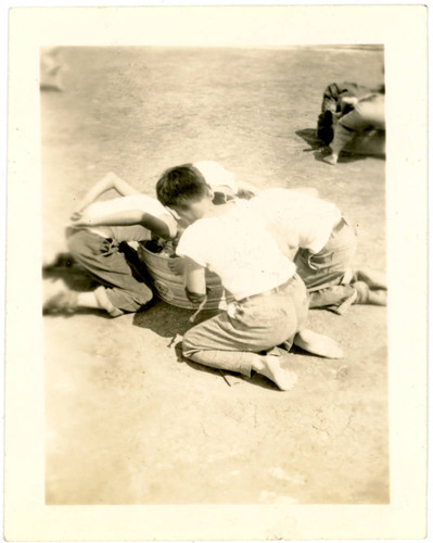 Young children bobbing for apples at incarceration camp