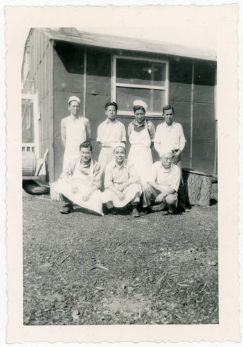 Men wearing aprons at Jerome incarceration camp