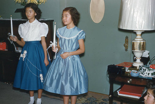 Girls holding candles