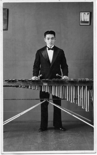 [Man with xylophone]