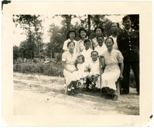 Yoshinaga family with man in military uniform