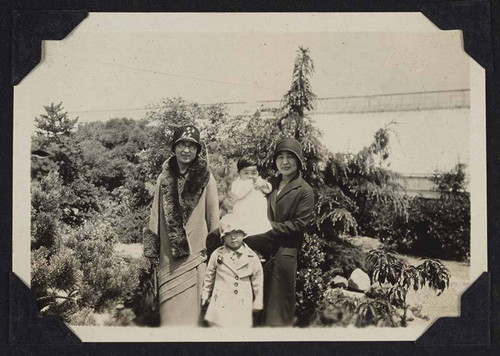 Women and children standing outside