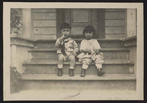 Young boy and girl on steps