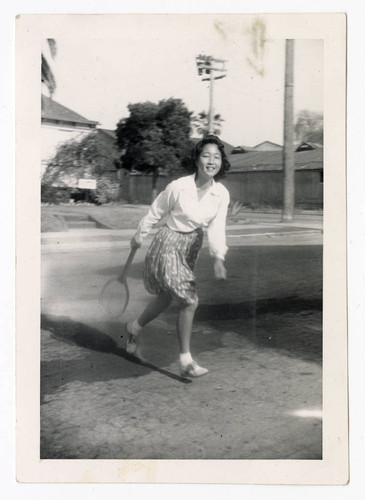 Woman holding tennis racket