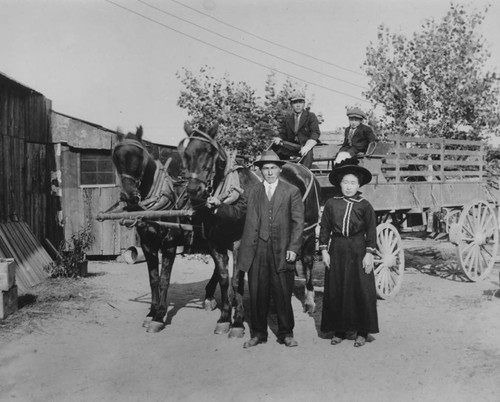 Family, horses, and wagon