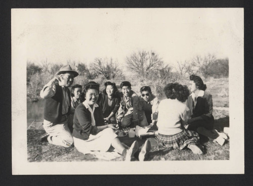 Sitting on blanket at Poston incarceration camp