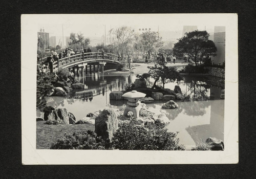 People walking across bridge