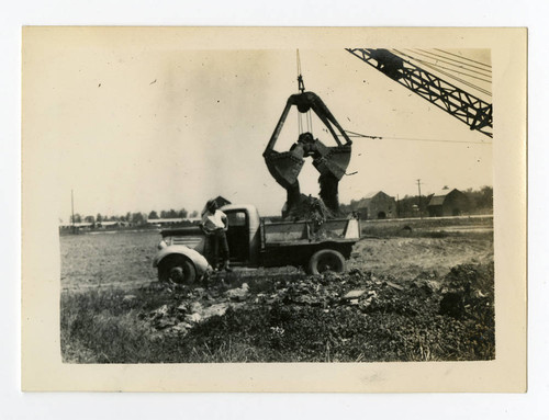 Filling truck with dirt