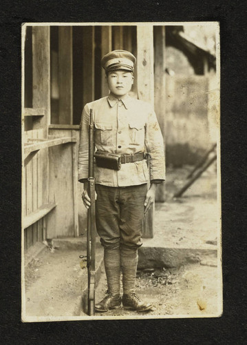 Young man in military uniform