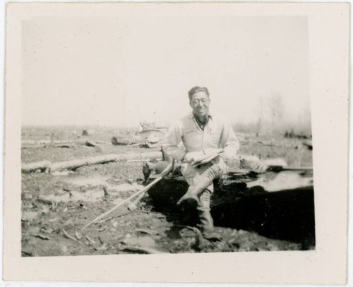 Man sitting on log