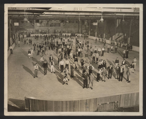 Ice skaters at indoor ice skating rink