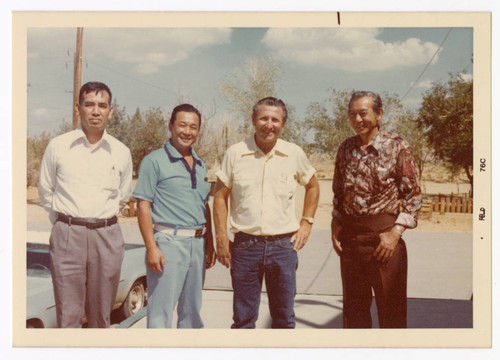 Minoru Frank Saito with Hughes Markets staff