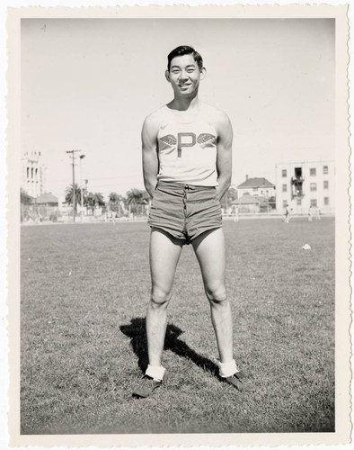 Minoru Frank Saito wearing John H. Francis Polytechnic High School track and field attire