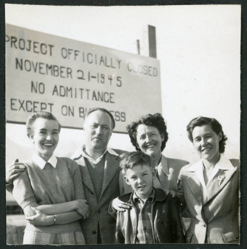 Photograph of Bea White and son, with Lucille Bouche and Elizabeth Moxley at the closing of Manzanar