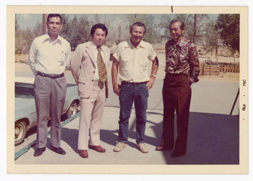 Minoru Frank Saito with Hughes Markets staff