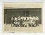 Nisei football players outside a barrack