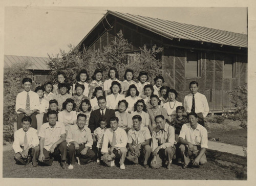 Poston incarcerees in front of barracks