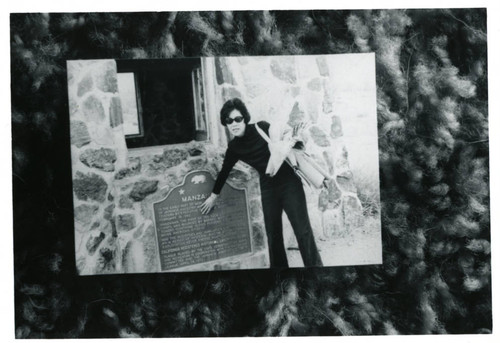 [Woman with Manzanar plaque]