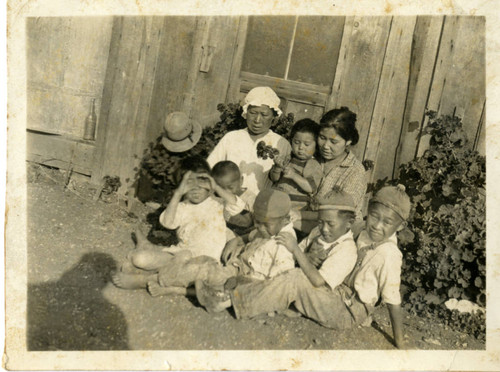 Family in front of House