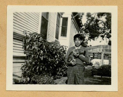 Takashi Ishida with a dog