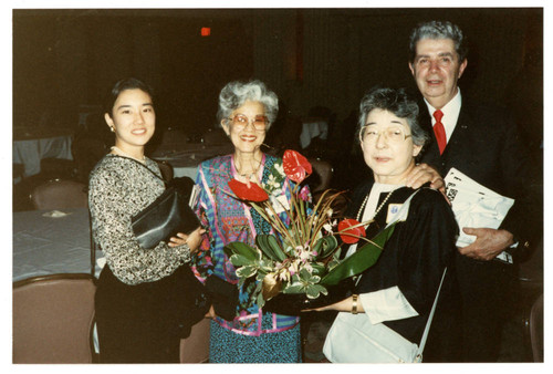 Aiko Herzig Yoshinaga and Jack Herzig with two women