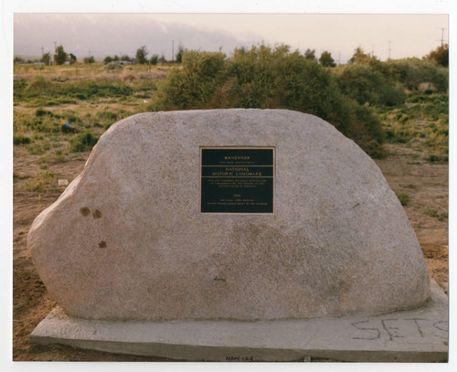 Color photo of 1986 pilgrimage showing National Historic Landmark plaque and marker