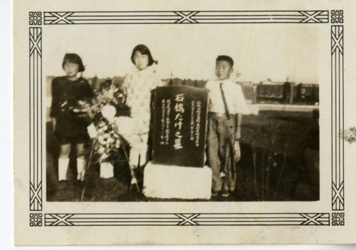 Three Children at a Gravesite