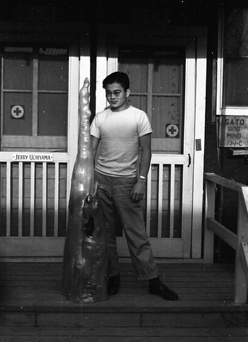 Man with sculpture in Jerome camp