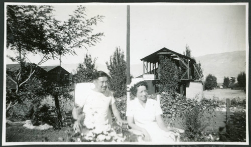 Photograph of Peter Hondo and Thelma McBride in a park at Manzanar