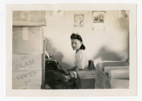 Woman at desk at Heart Mountain