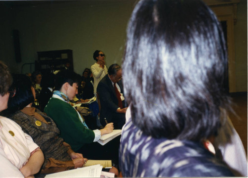 NCJAR press conference: Alice Basoms (white blouse), Chizu Omori (suit) Penny Willgerodt (green sweater), and Michi Weglyn (standing)