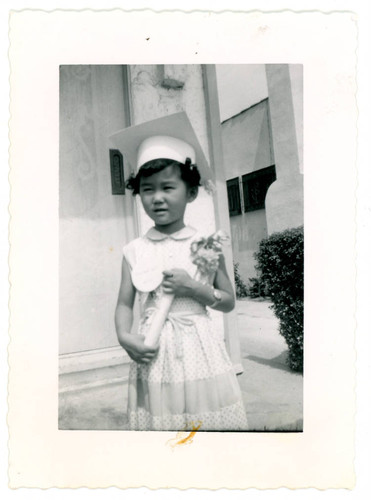 Julia Yoshinaga wearing graduation cap