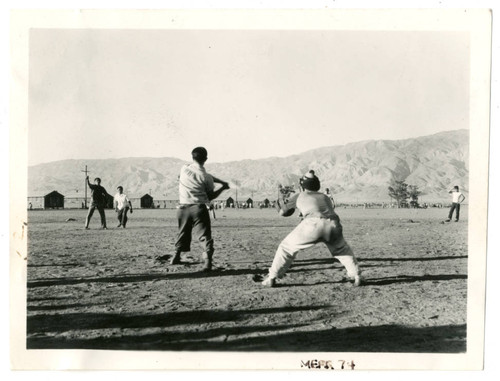 Photograph of boys playing baseball at Manzanar