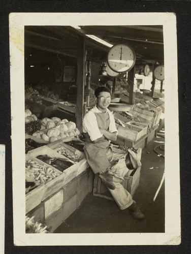 Shiego Takahashi in front of fruit stand