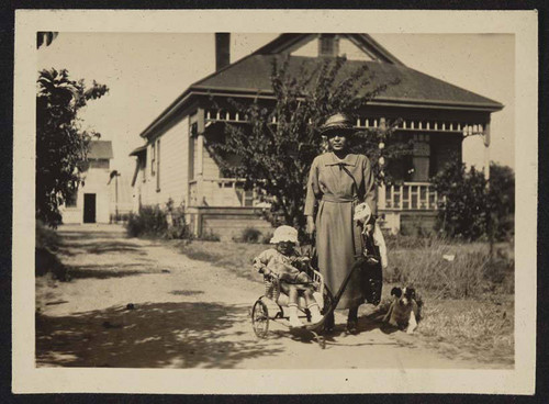 Mother with young girl in wagon