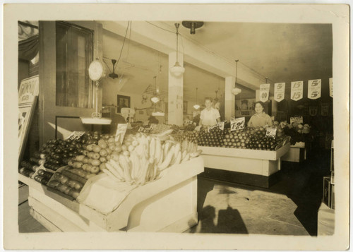 Kuni Fuchita behind produce stall