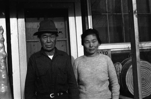 Man and woman on porch in Jerome camp