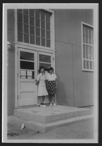 [Two ladies and a building]