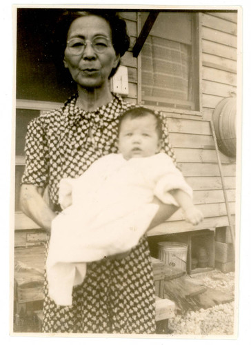 Shigeru Yoshinaga holding baby