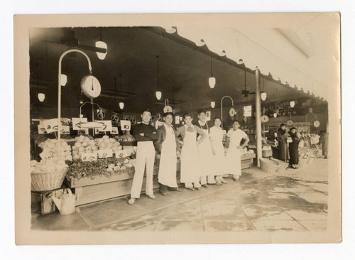 Nakao Nick Saito working at a produce market