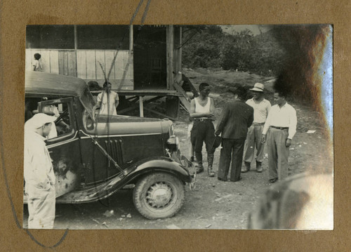 Japanese Peruvian men with a car