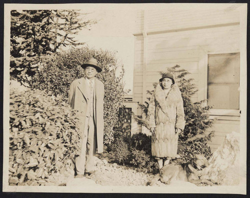 Man and woman in a family yard