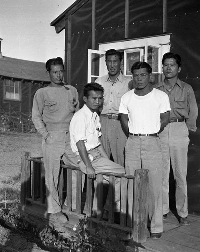 Nisei men on a porch in Jerome camp