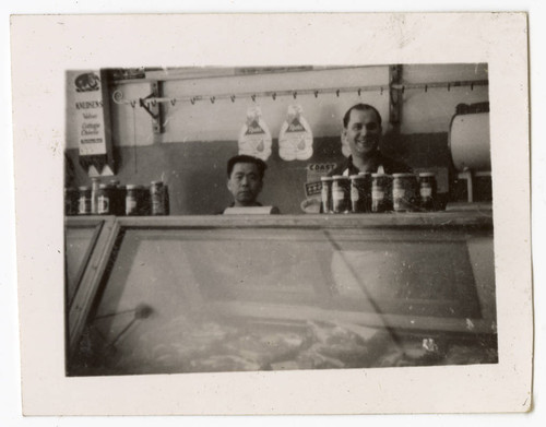 Frank Yoshinaga behind grocery counter